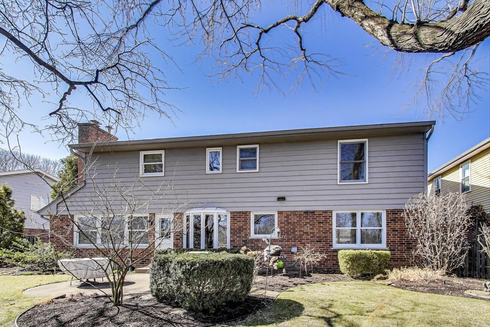 2207 North Brighton Place Arlington Heights, IL 60004 - Photo 29 of 37 a brick building with a bench in front of it