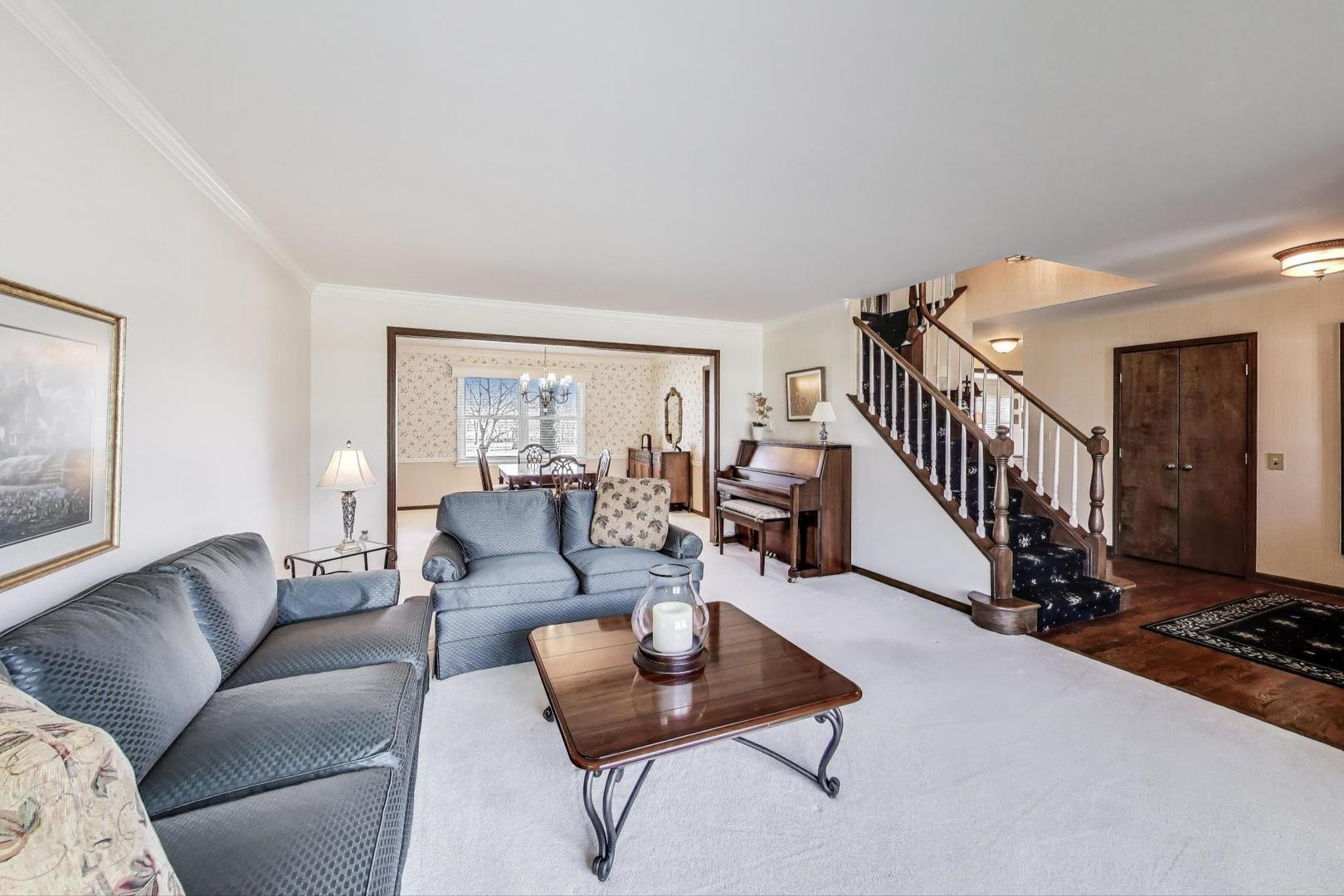 2207 North Brighton Place Arlington Heights, IL 60004 - Photo 3 of 37 a living room with furniture and a table
