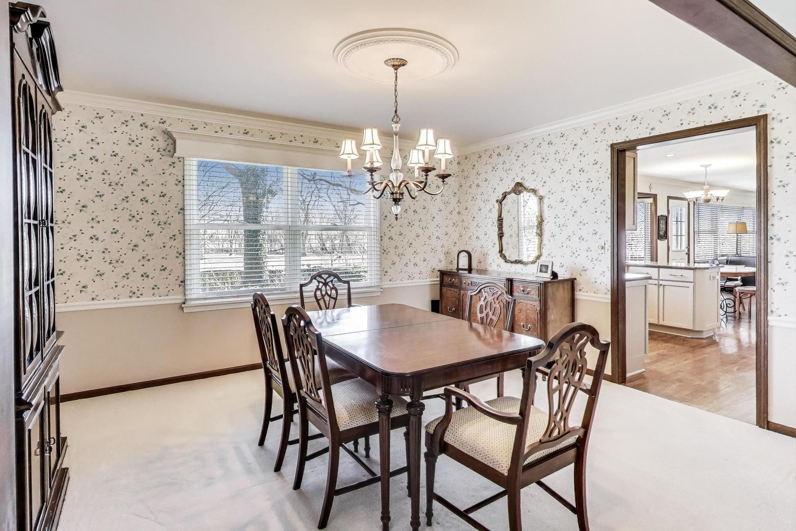 2207 North Brighton Place Arlington Heights, IL 60004 - Photo 5 of 37 a view of a dining room with furniture and chandelier