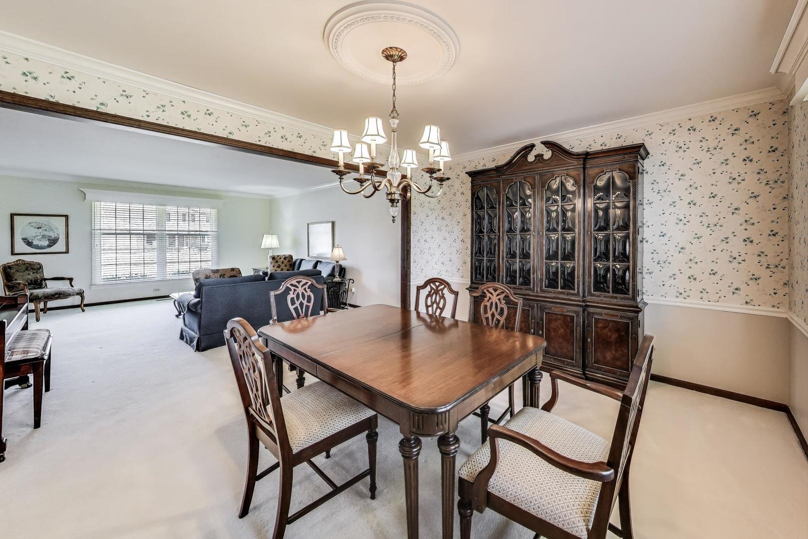 2207 North Brighton Place Arlington Heights, IL 60004 - Photo 6 of 37 a view of a dining room with furniture and chandelier