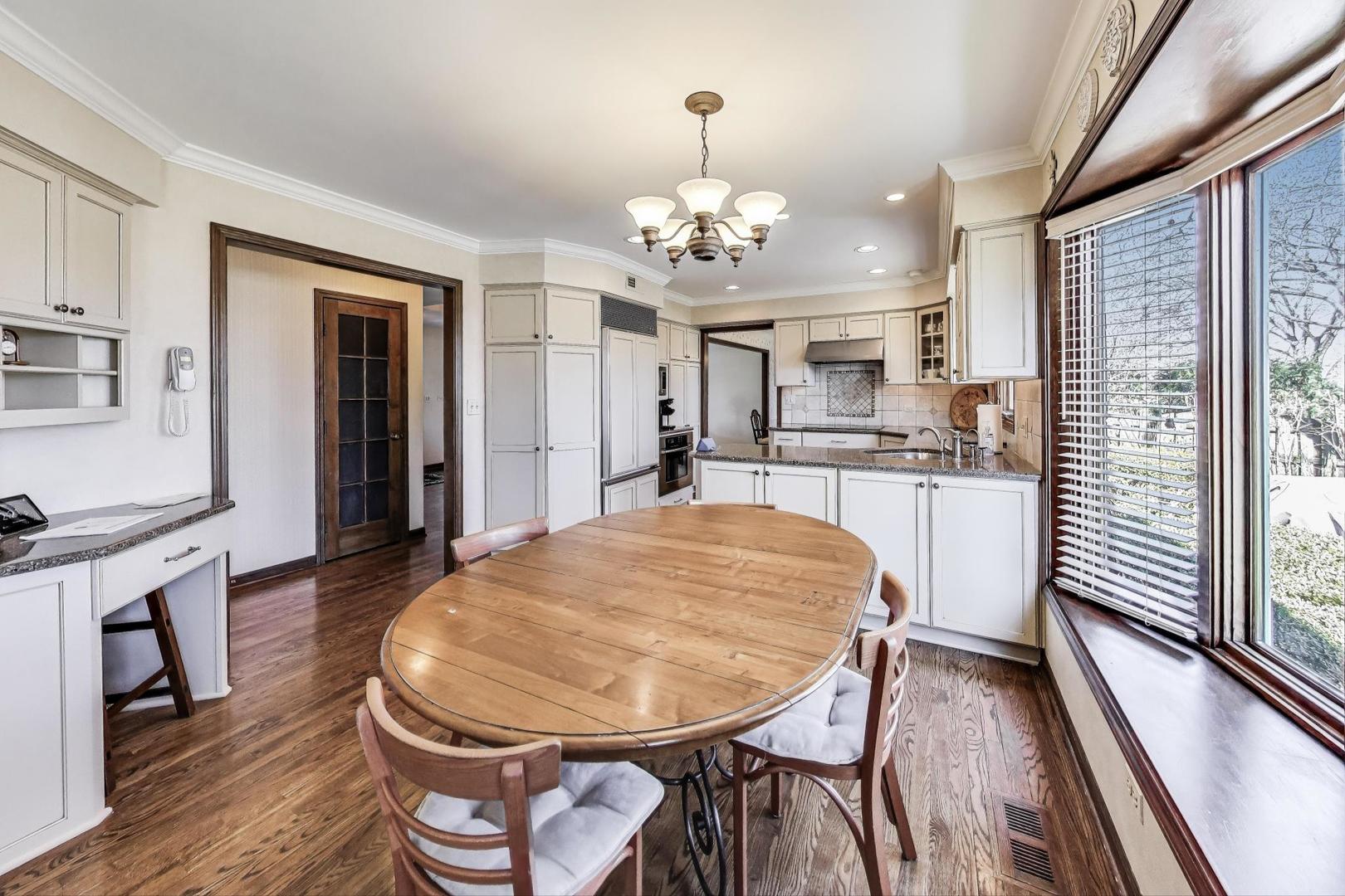2207 North Brighton Place Arlington Heights, IL 60004 - Photo 10 of 37 a view of a dining room with furniture window and wooden floor