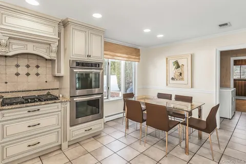 a kitchen with granite countertop cabinets and steel stainless steel appliances