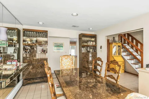 a view of a livingroom with furniture and a rug