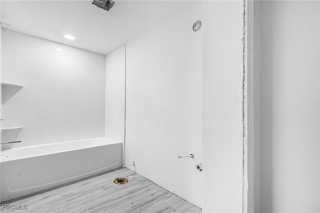 16881 Davis Road, Unit 412 Fort Myers, FL 33908 - Photo 15 of 27 a view of bathroom with bathtub and shower