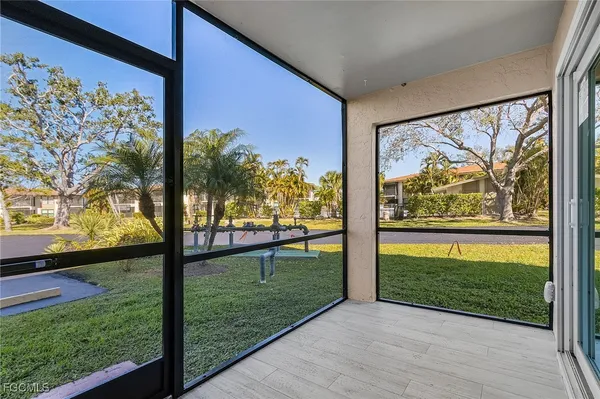 a view of a house with pool and sitting area