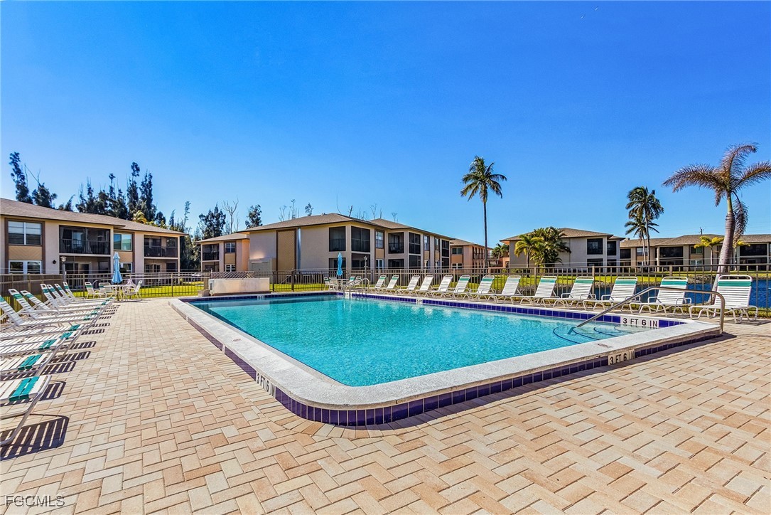 16881 Davis Road, Unit 412 Fort Myers, FL 33908 - Photo 20 of 27 a view of a house with pool and sitting area