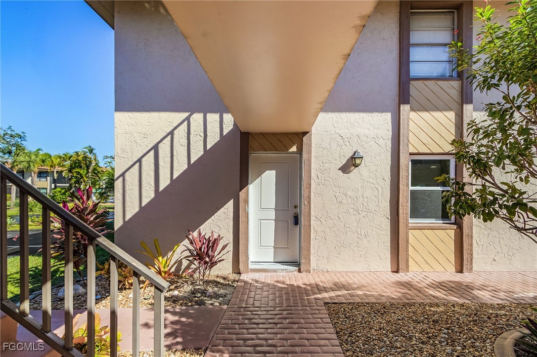 16881 Davis Road, Unit 412 Fort Myers, FL 33908 - Photo 2 of 27 a view of entryway with a front door