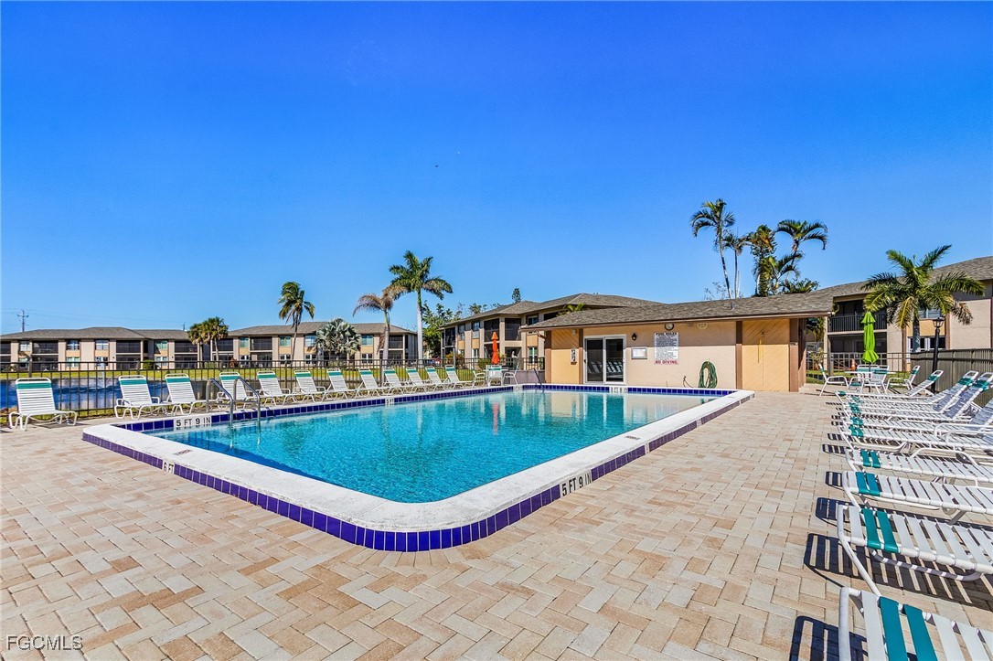 16881 Davis Road, Unit 412 Fort Myers, FL 33908 - Photo 21 of 27 a view of a house with a swimming pool