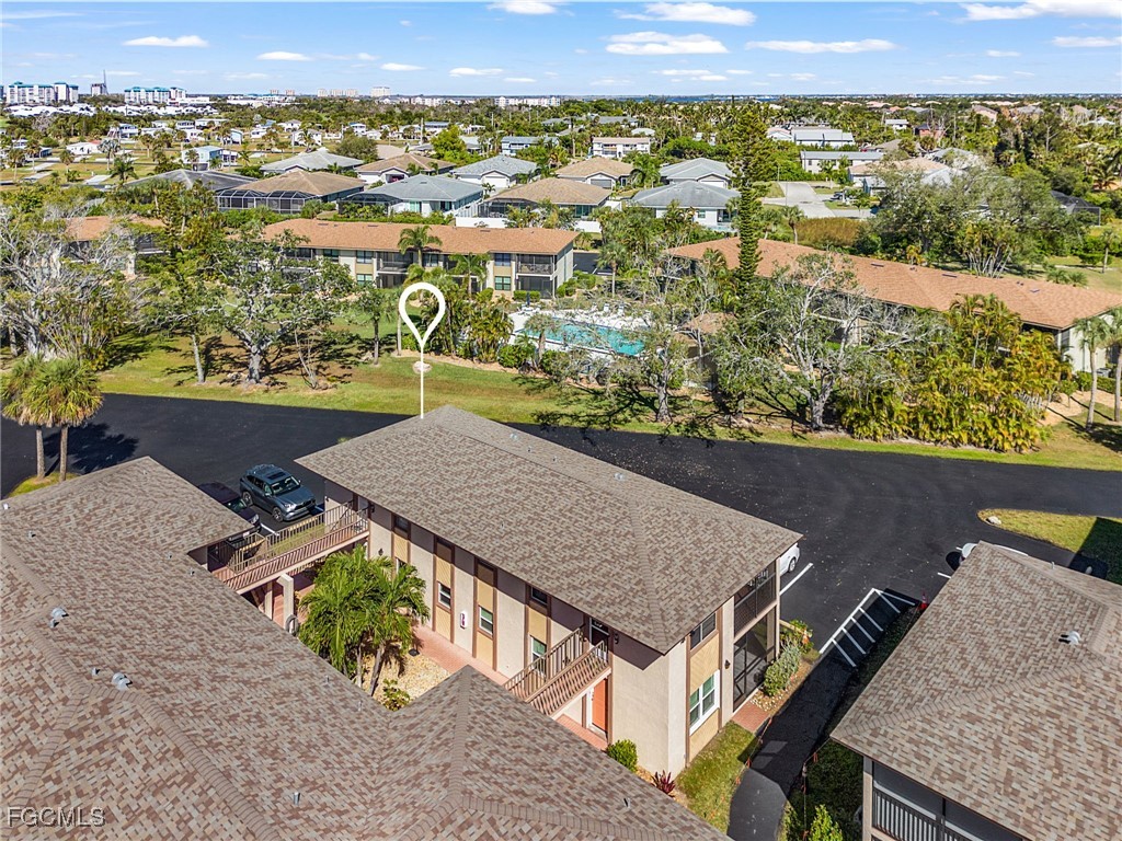 16881 Davis Road, Unit 412 Fort Myers, FL 33908 - Photo 25 of 27 an aerial view of residential houses with outdoor space