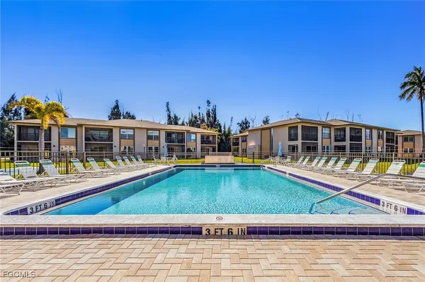 a house with swimming pool in front of it