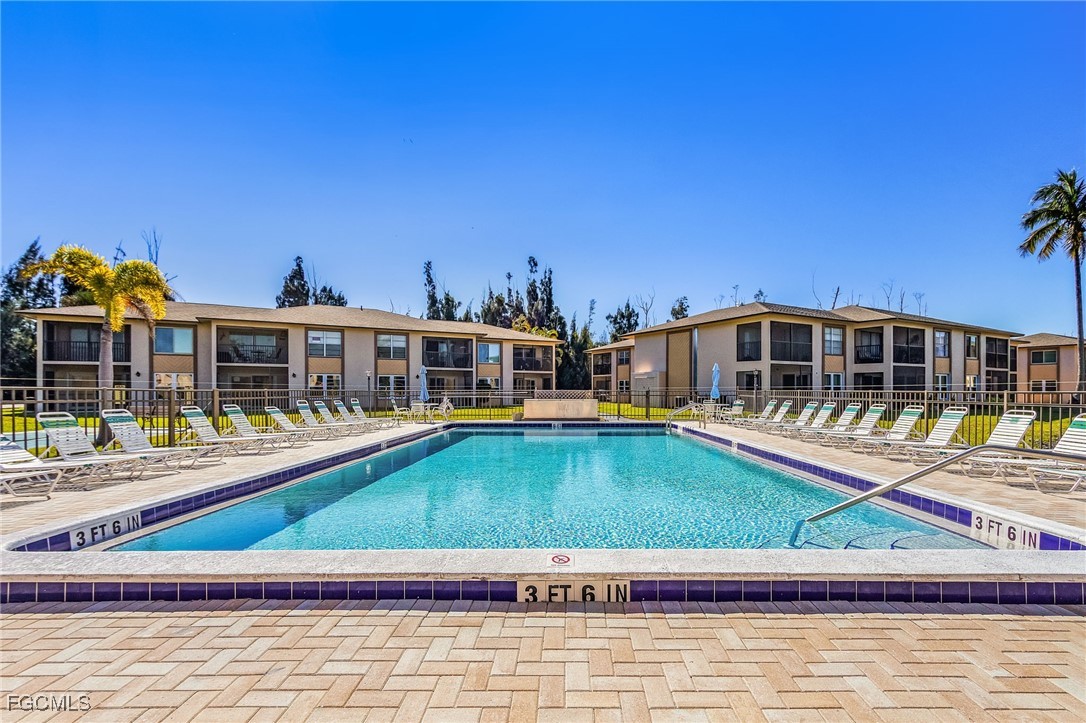 16881 Davis Road, Unit 412 Fort Myers, FL 33908 - Photo 3 of 27 a house with swimming pool in front of it