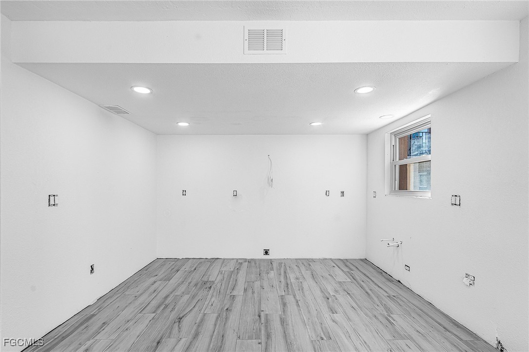 16881 Davis Road, Unit 412 Fort Myers, FL 33908 - Photo 10 of 27 a view of a room with wooden floor
