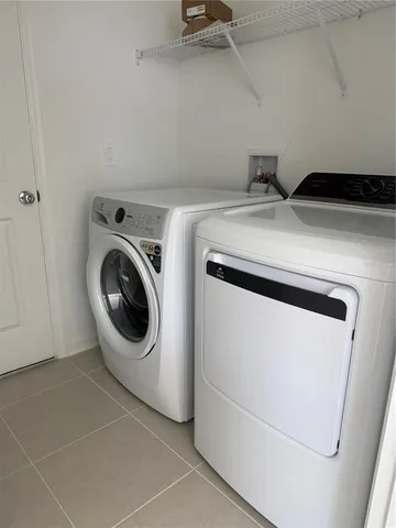 a utility room with dryer and washer