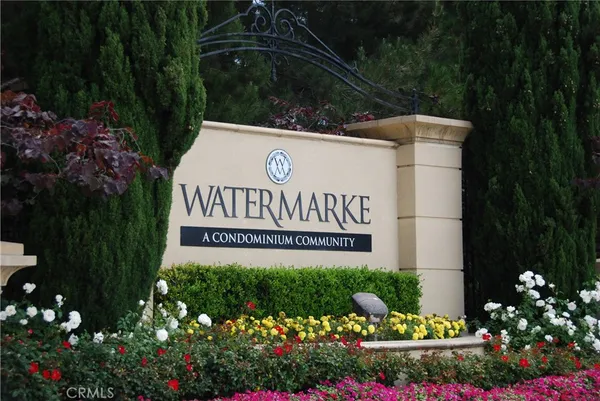a sign that is in front of flowers