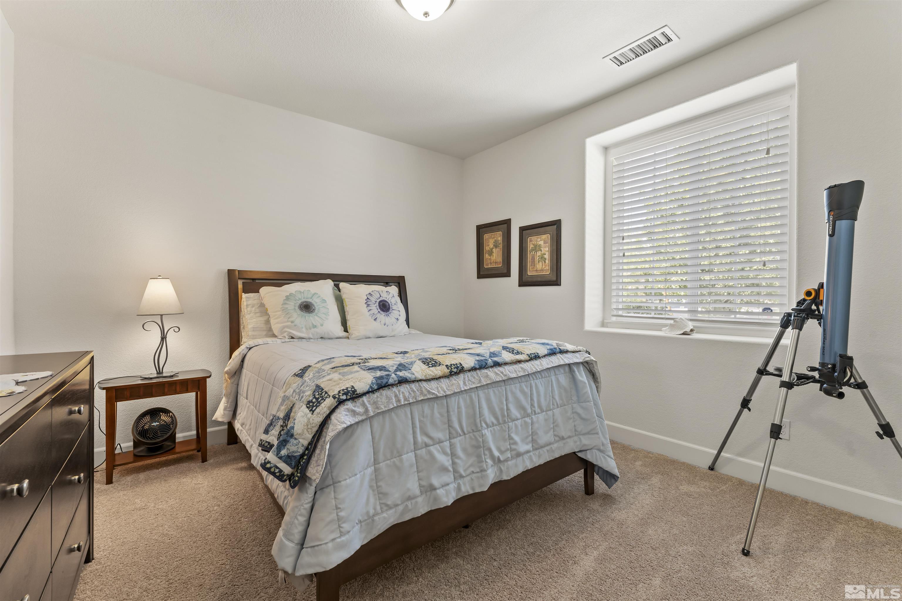 2082 Whitecliff Drive Reno, NV 89521 - Photo 29 of 40 a bedroom with a bed and a window