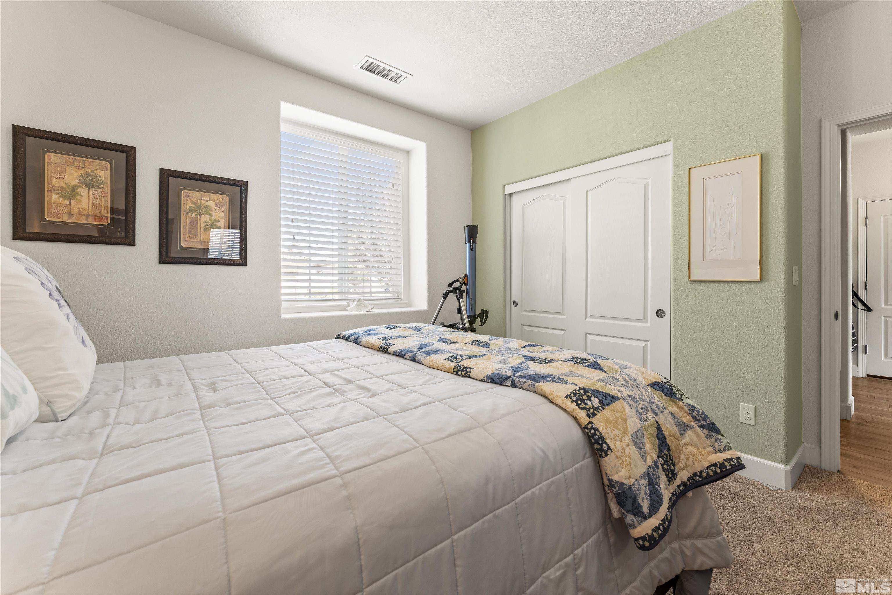 2082 Whitecliff Drive Reno, NV 89521 - Photo 30 of 40 a bedroom with a bed and a window