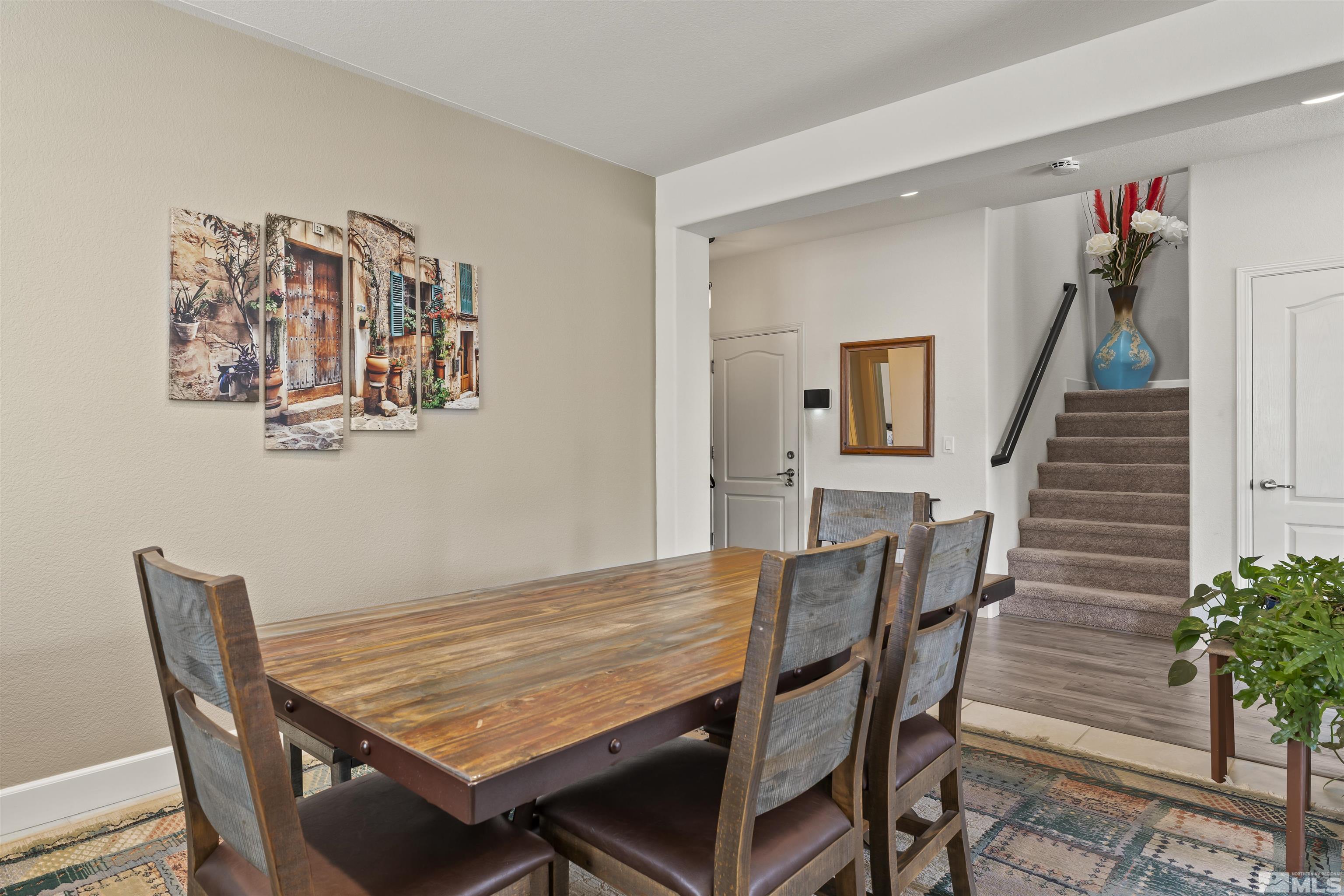 2082 Whitecliff Drive Reno, NV 89521 - Photo 8 of 40 a view of a dining room with furniture and wooden floor