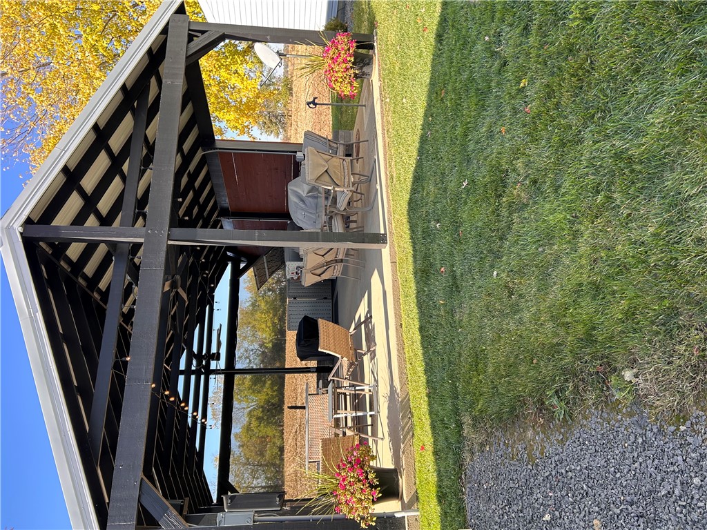 2086 Scheyhing Road Lewisburg, OH 45338 - Photo 25 of 29 Enjoy outdoor living under this spacious, covered patio perfect for relaxation and entertainment.