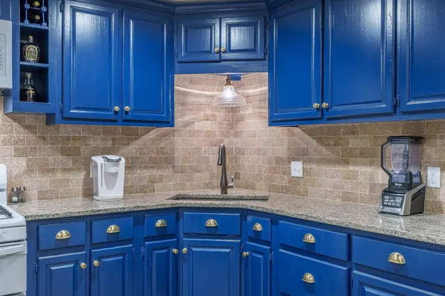 a spacious bedroom with a bed and a couch