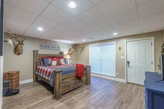 a bedroom with a bed and dresser