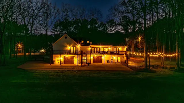a house view with outdoor space and garden