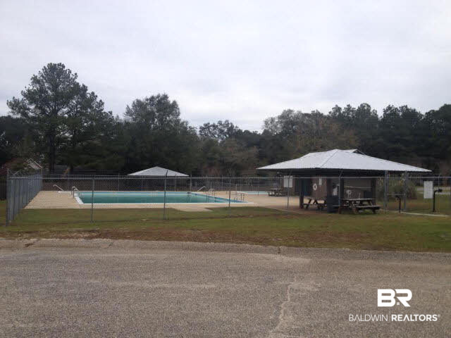 111 Woodside Drive Daphne, AL 36526 - Photo 31 of 31 This is the neighborhood pool that is only one block from this home. The home is located on a nicely wooded quiet dead end street.