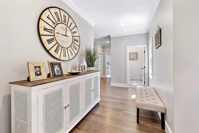 a view of an entryway with wooden floor