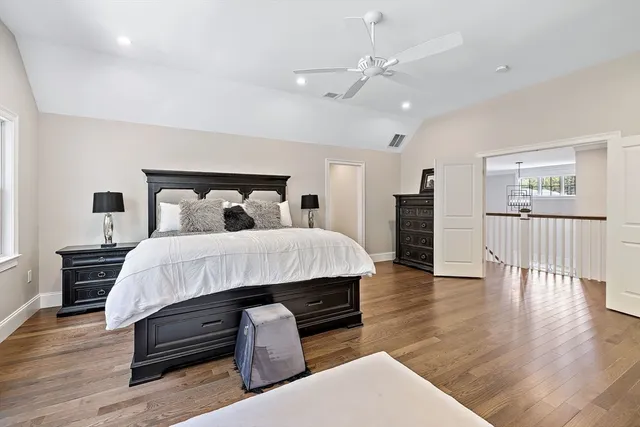 a bed room with furniture and wooden floor