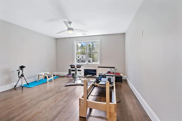 a living room with a couch and a chandelier