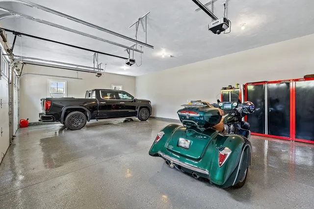 a front view of a house with a yard and entertaining space