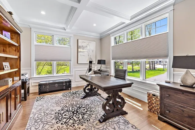 a room with furniture pool table and a flat screen tv