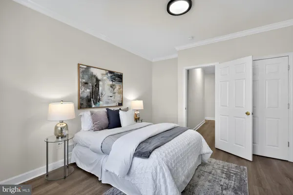 a bedroom with a bed and a lamp