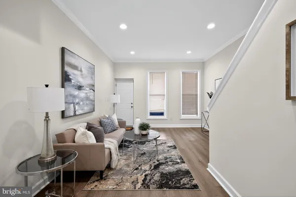 a living room with furniture and a rug