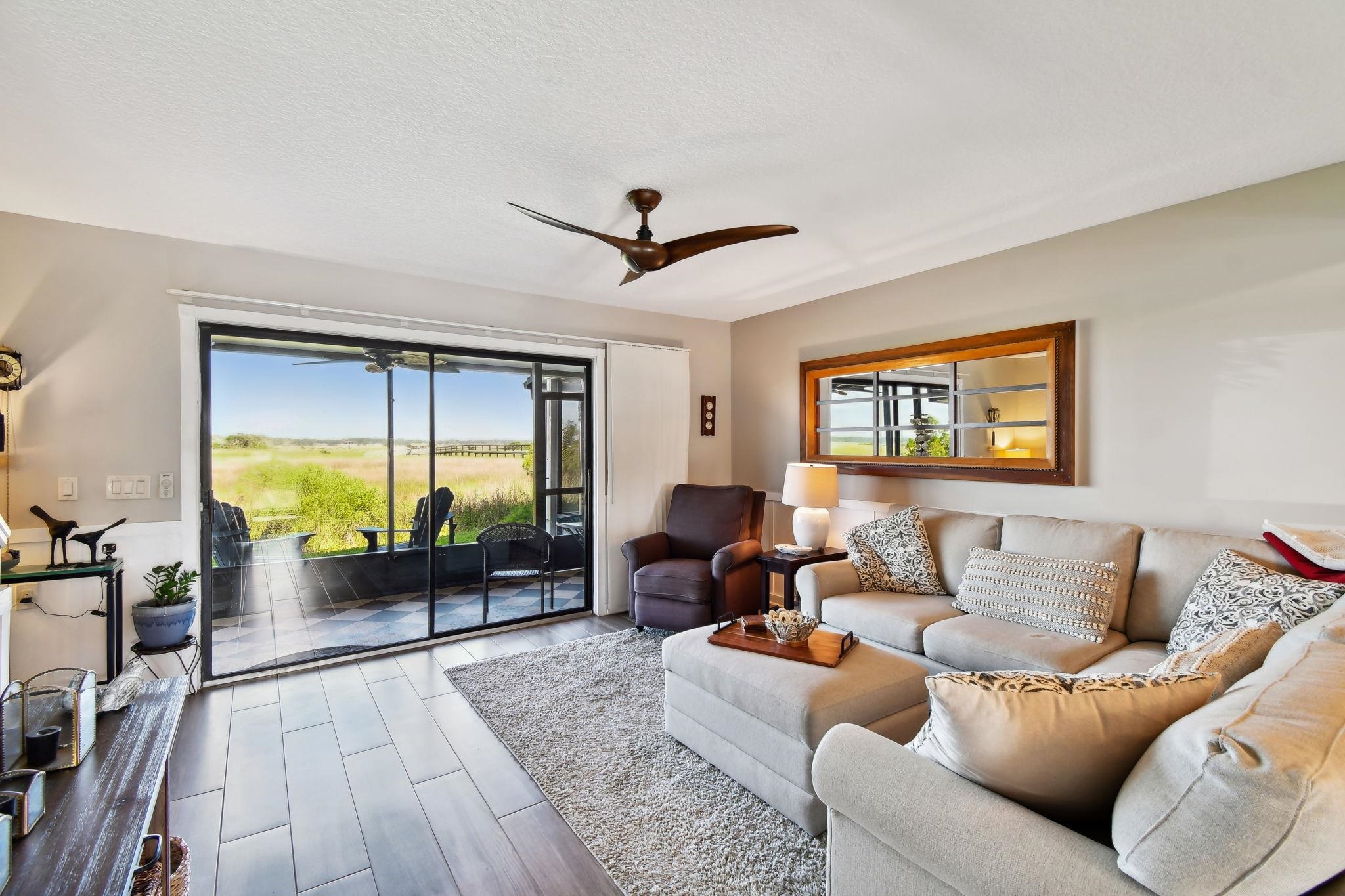 131 Rio Del Mar Street, Unit E St. Augustine, FL 32080 - Photo 26 of 67 a living room with furniture and a large window