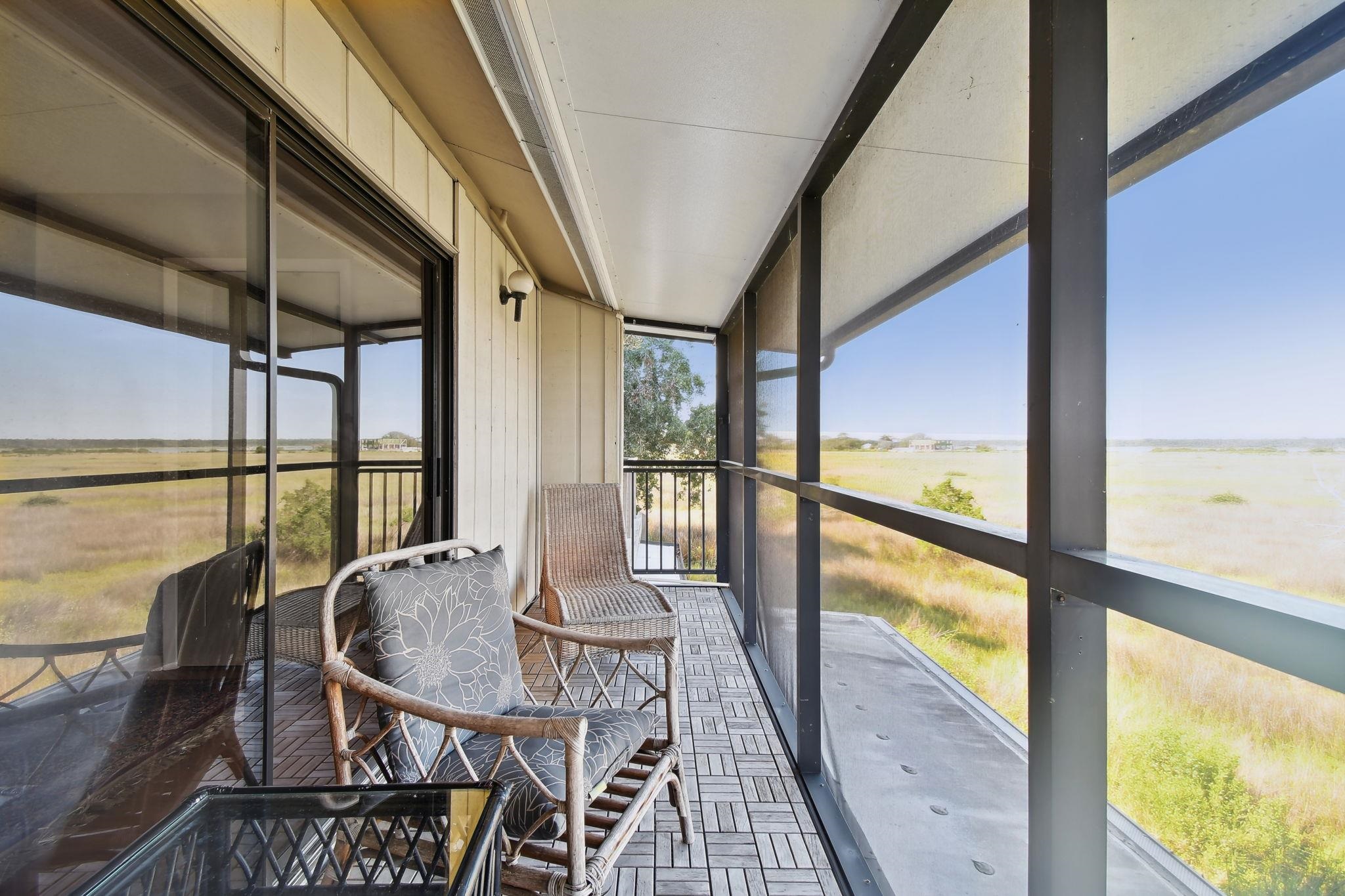 131 Rio Del Mar Street, Unit E St. Augustine, FL 32080 - Photo 34 of 67 a view of a city from a balcony with furniture