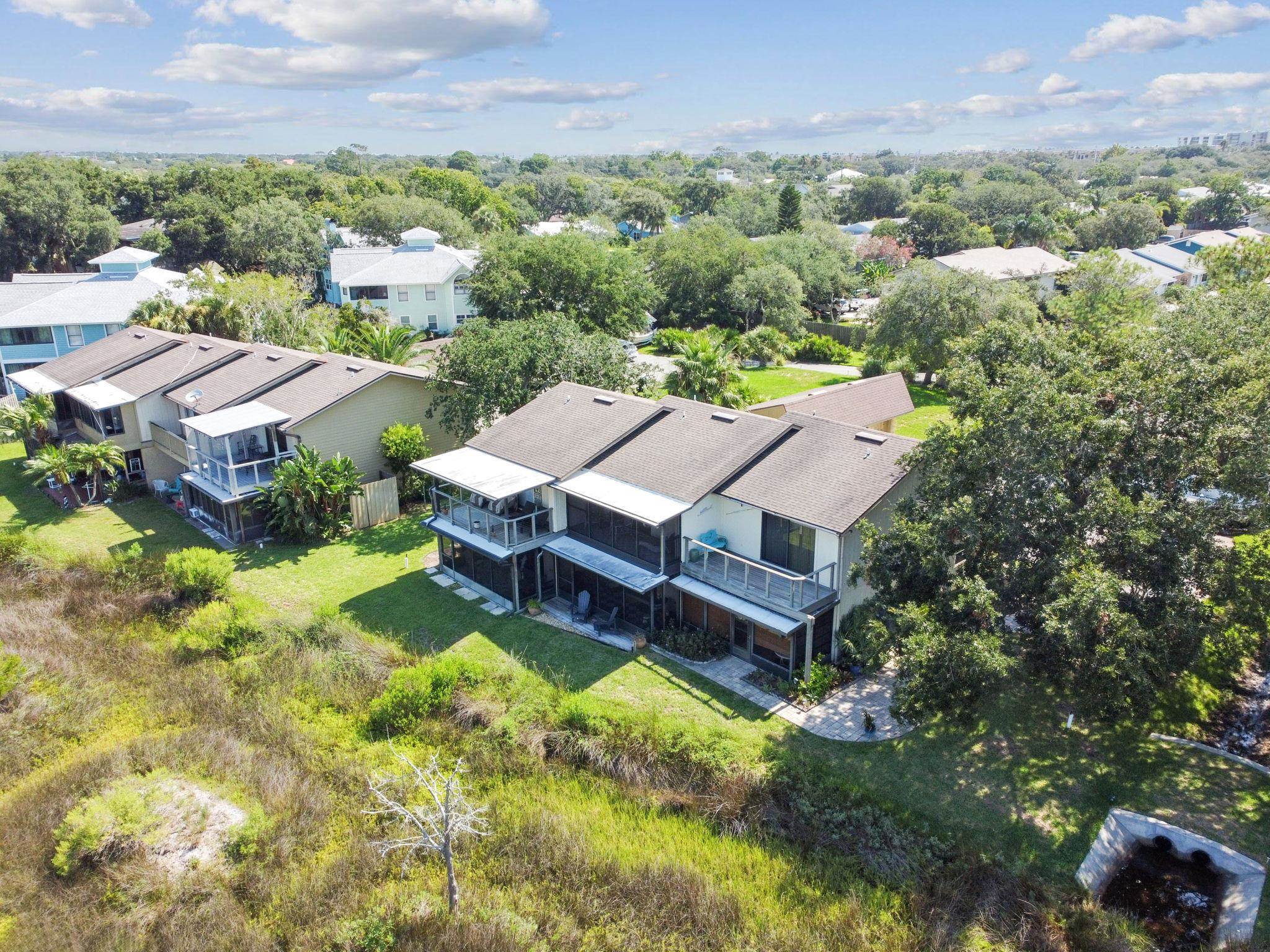 131 Rio Del Mar Street, Unit E St. Augustine, FL 32080 - Photo 48 of 67 an aerial view of a house with swimming pool and mountains