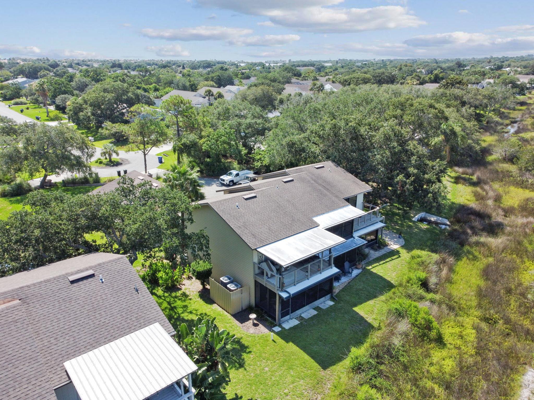 131 Rio Del Mar Street, Unit E St. Augustine, FL 32080 - Photo 49 of 67 an aerial view of a house with a garden
