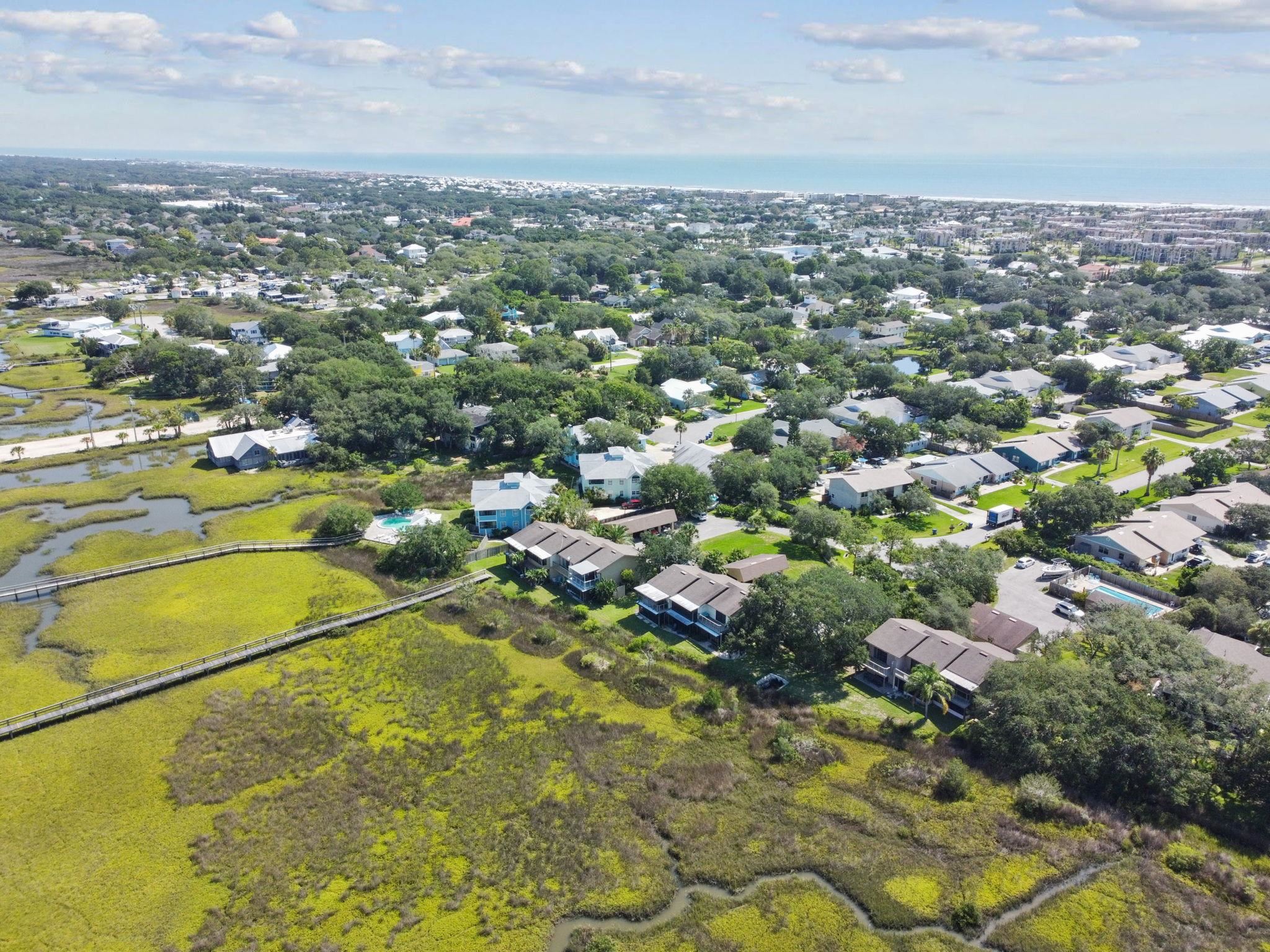 131 Rio Del Mar Street, Unit E St. Augustine, FL 32080 - Photo 54 of 67 an aerial view of residential houses with outdoor space