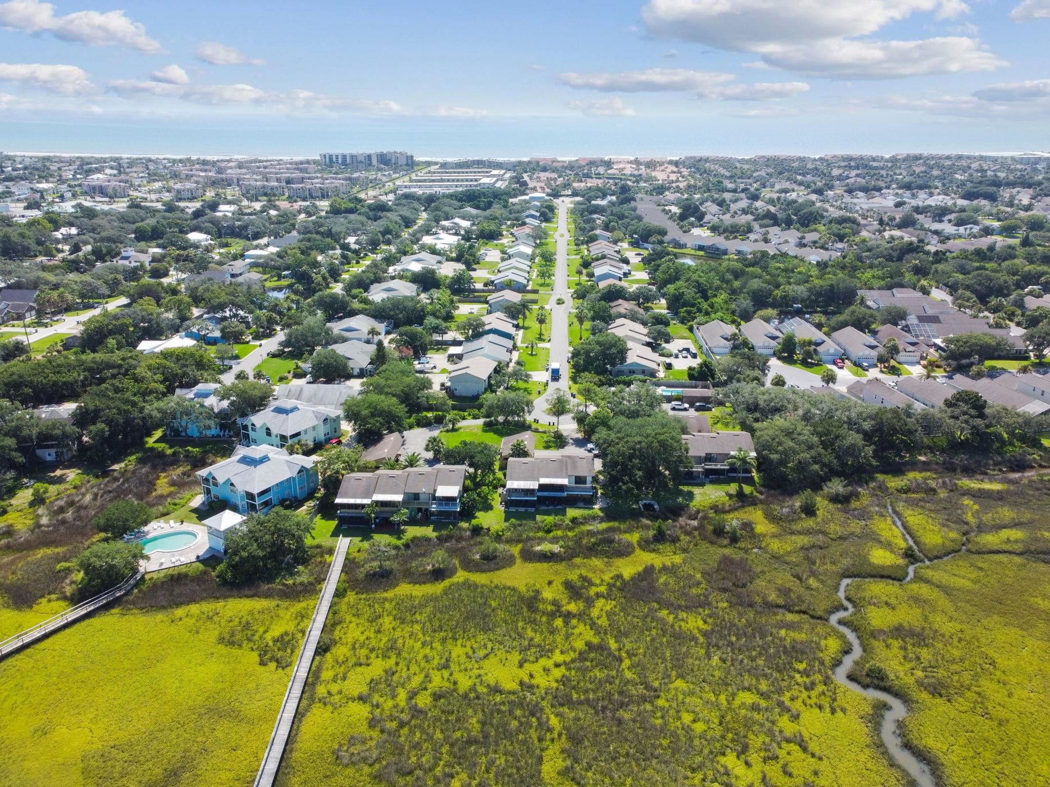 131 Rio Del Mar Street, Unit E St. Augustine, FL 32080 - Photo 55 of 67 an aerial view of residential houses with outdoor space