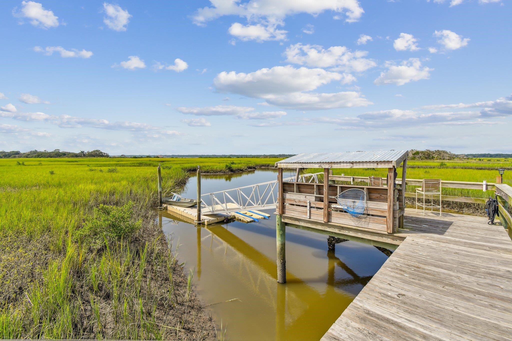 131 Rio Del Mar Street, Unit E St. Augustine, FL 32080 - Photo 65 of 67 a view of a swimming pool with an outdoor seating