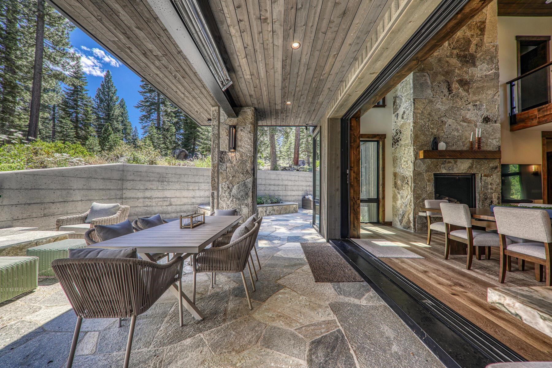 10645 Carson Range Road Truckee, CA 96161 - Photo 11 of 28 a view of a patio with table and chairs with wooden floor and fence