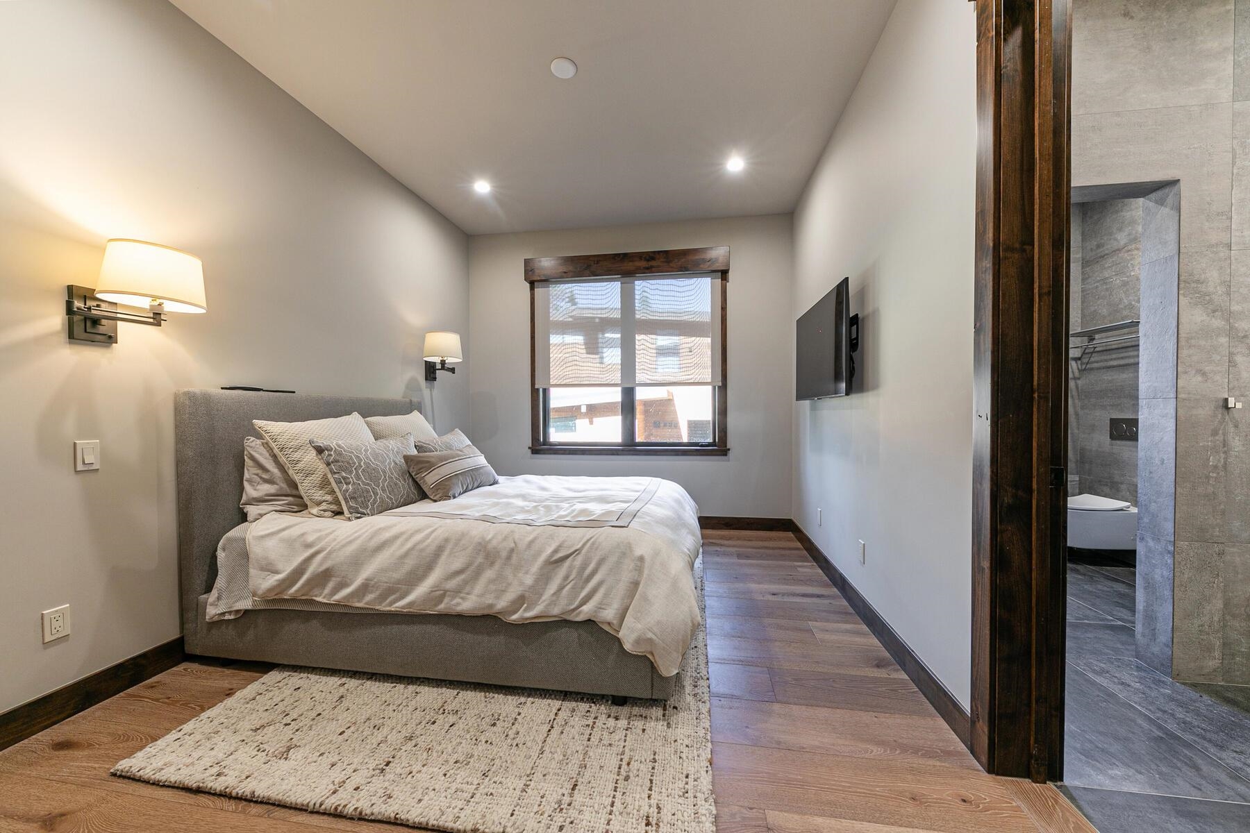 10645 Carson Range Road Truckee, CA 96161 - Photo 16 of 28 a bedroom with a bed and a window