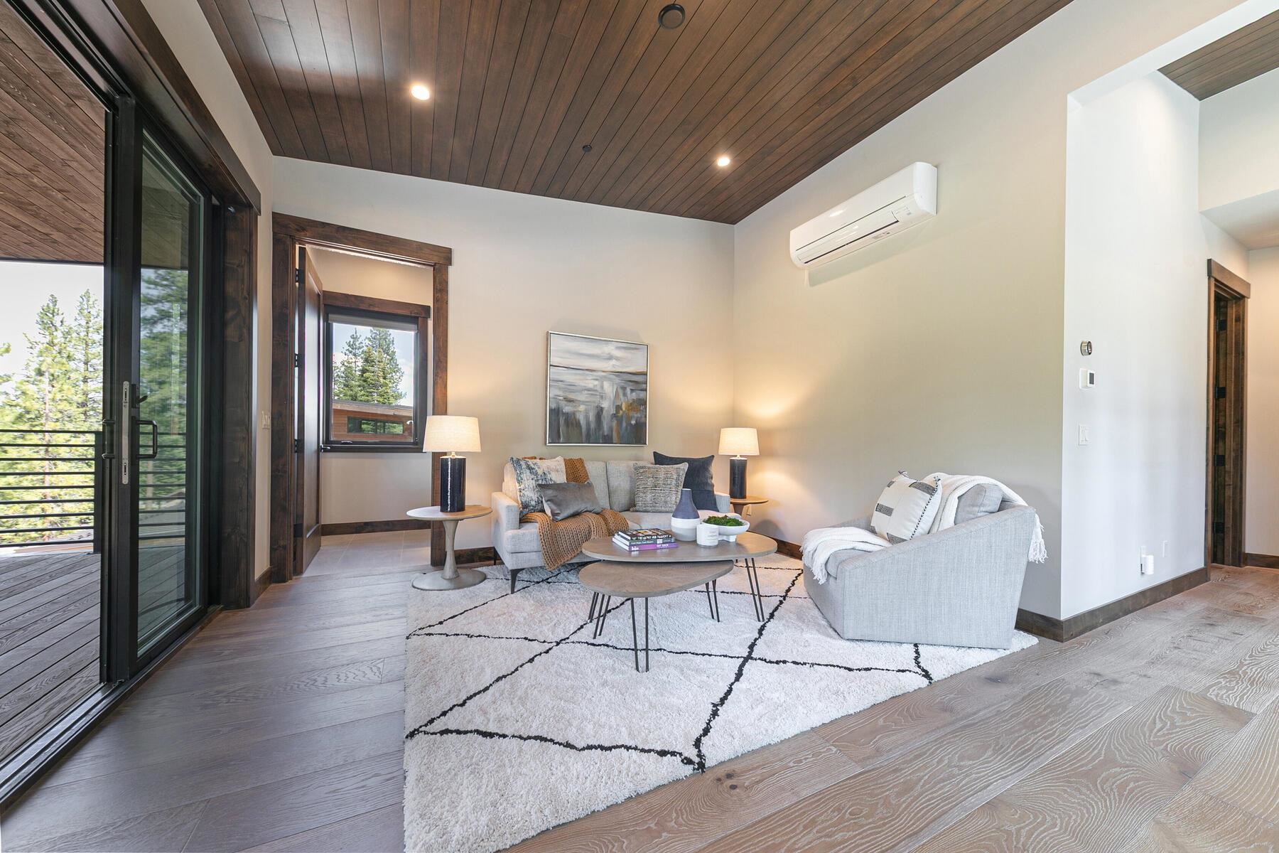 10645 Carson Range Road Truckee, CA 96161 - Photo 20 of 28 a living room with furniture and large windows