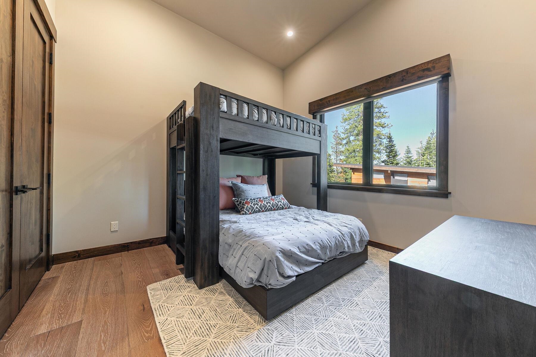 10645 Carson Range Road Truckee, CA 96161 - Photo 23 of 28 a bedroom with a large bed and a window