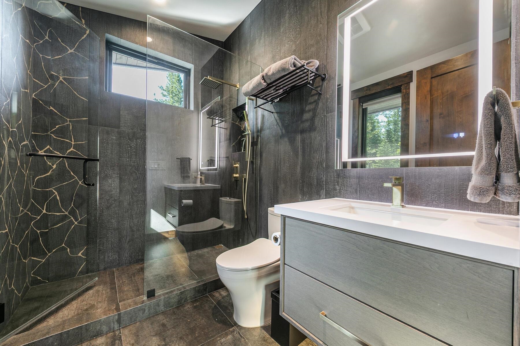 10645 Carson Range Road Truckee, CA 96161 - Photo 28 of 28 a bathroom with a sink a toilet and shower