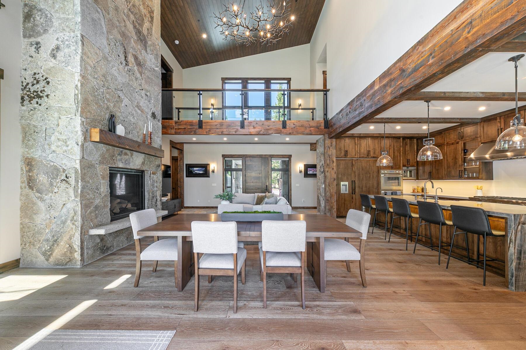 10645 Carson Range Road Truckee, CA 96161 - Photo 3 of 28 a dining room with wooden floor and chandelier