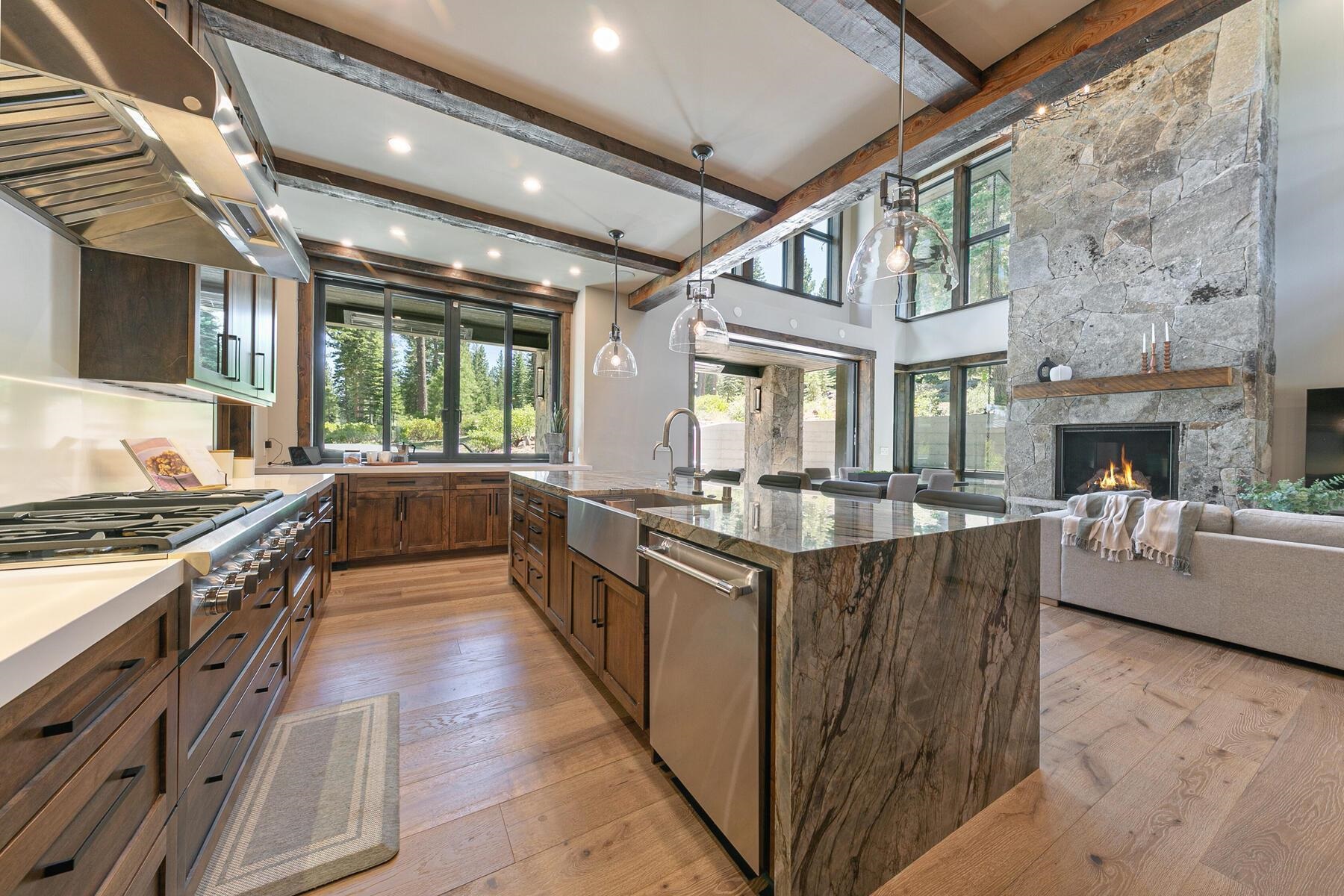 10645 Carson Range Road Truckee, CA 96161 - Photo 7 of 28 a large kitchen with stainless steel appliances granite countertop a large stove a sink dishwasher and a stove next to a large window
