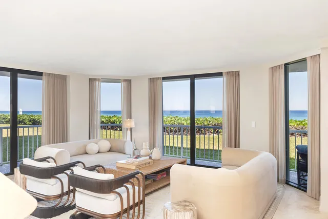 a spacious bedroom with a bed and a large window