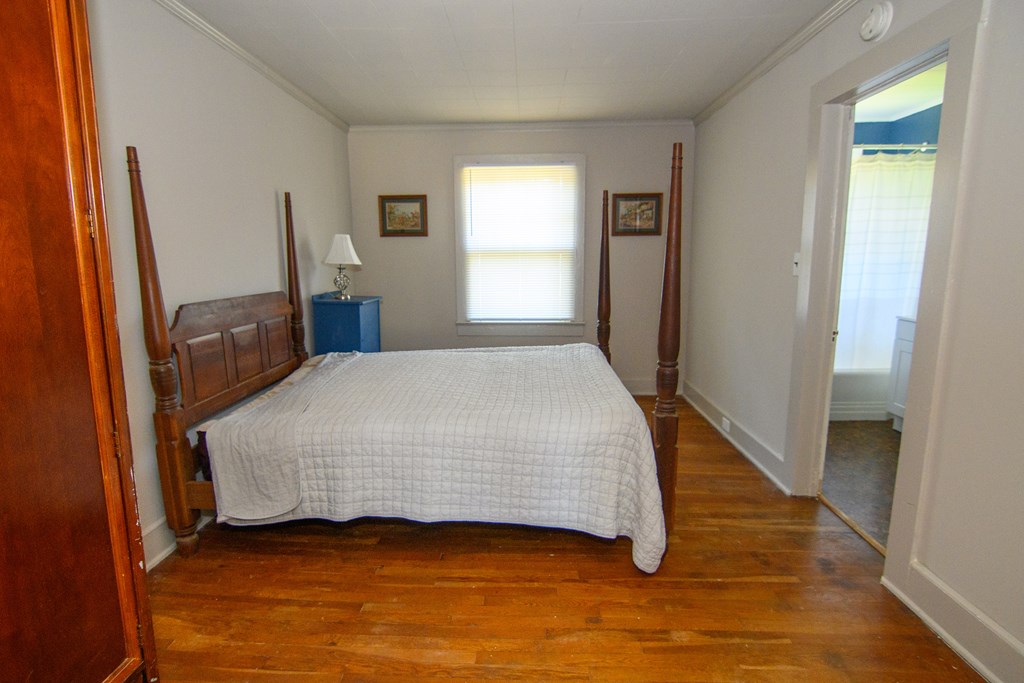 24432 Maxwell Street Parksley, VA 23421 - Photo 20 of 39 a bedroom with a bed and window