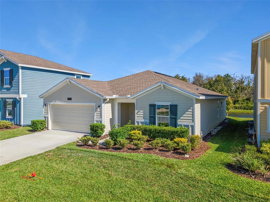 2011 Myrtle Pine Street Kissimmee, FL 34746 - Photo 1 of 28 a front view of a house with garden